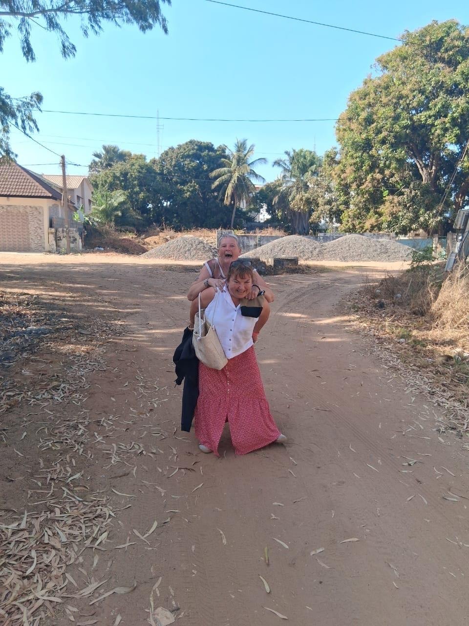 Claire meeting with a healthcare worker at the Bakau community clinic